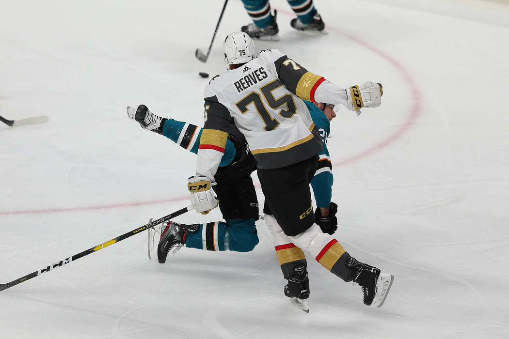 Vegas Golden Knights right wing Ryan Reaves (75) takes down San Jose Sharks right wing Timo Mei ...