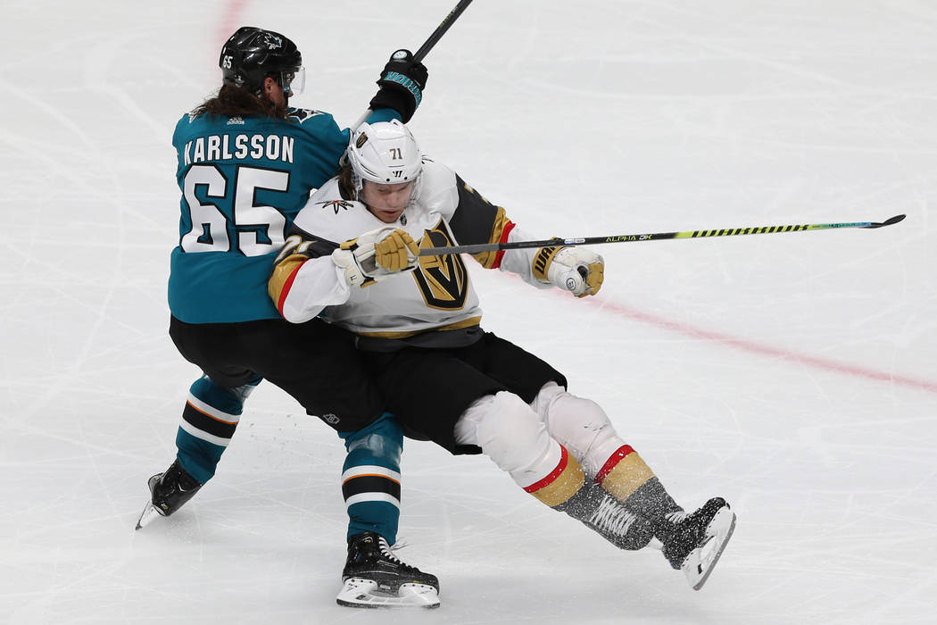 San Jose Sharks defenseman Erik Karlsson (65) takes down Vegas Golden Knights center William Ka ...