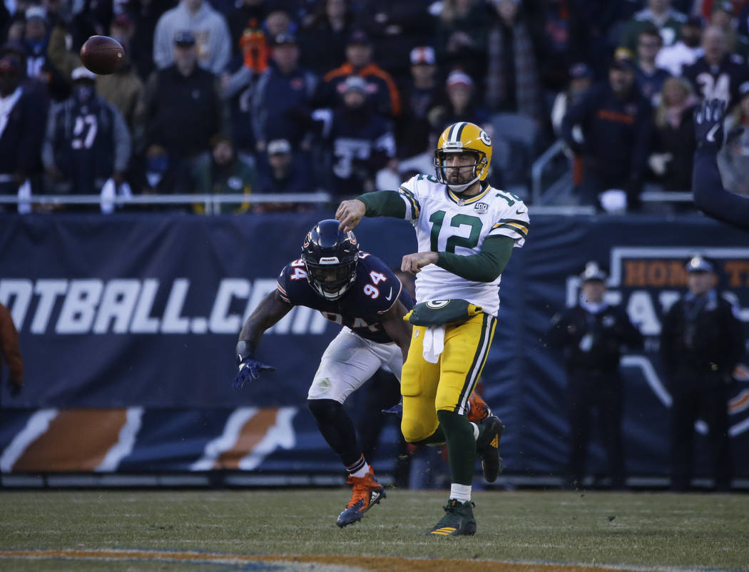 Green Bay Packers quarterback Aaron Rodgers (12) looks to pass against the Chicago Bears during ...