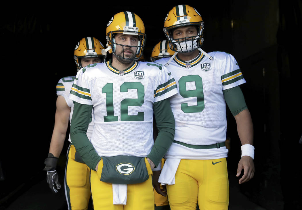 FILE - In this Sunday, Dec. 16, 2018, file photo, Green Bay Packers quarterbacks Aaron Rodgers ...