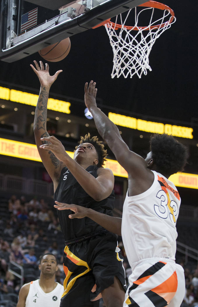 Armando Bacot Jr. shoots over Isaiah Stewart (33) in the first half during the Jordan Brand Cla ...