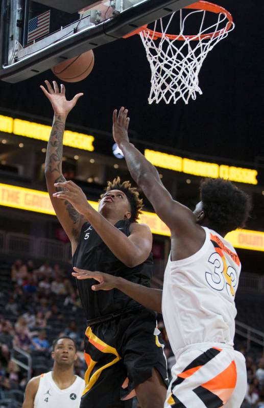 Armando Bacot Jr. shoots over Isaiah Stewart (33) in the first half during the Jordan Brand Cla ...