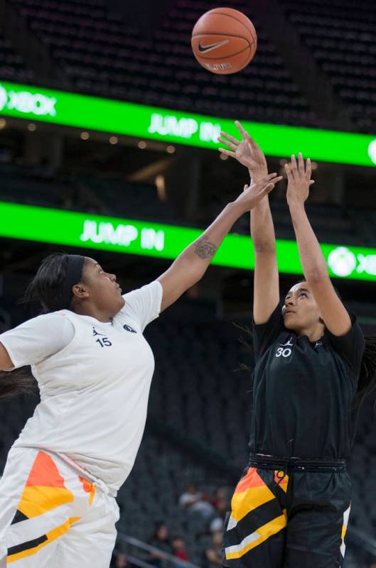 Haley Jones (30) shoots over Angel Jackson (15) in the second quarter during the Jordan Brand C ...