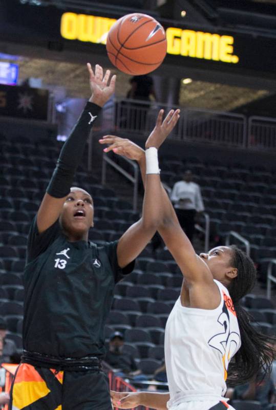 Jordan Horston (13) drives over Charisma Osborne (20) in the first quarter during the Jordan Br ...