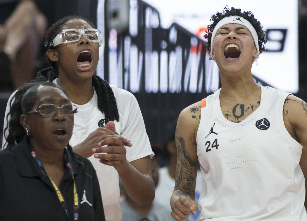 Francesca Belibi (1) and Kierstan Bell (24) cheer for their team in the fourth quarter during t ...