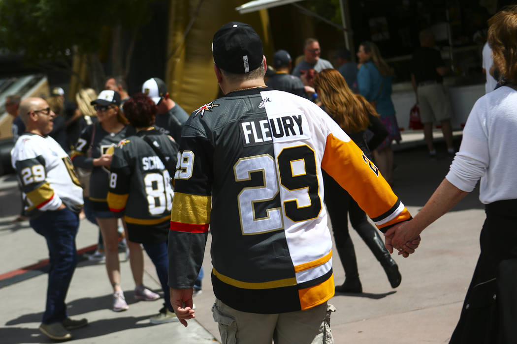 A Golden Knights fan wears a hybrid Marc-Andre Fleury jersey before the start of Game 6 of an N ...
