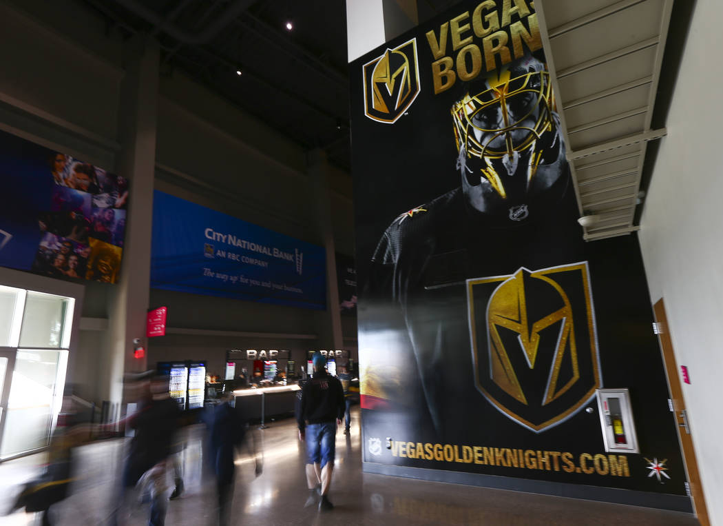 Golden Knights fans walk the concourse before the start of Game 6 of an NHL Western Conference ...