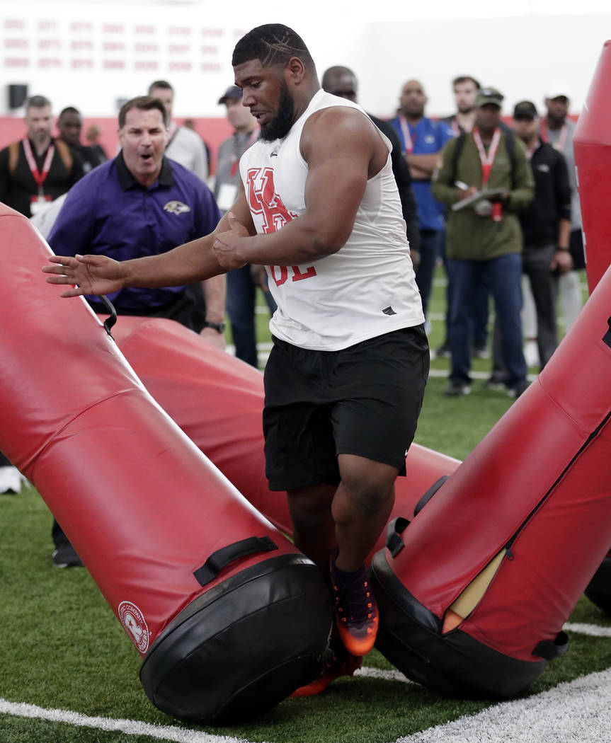 Houston defensive lineman Ed Oliver Jr. participates in drills during Pro Day at the indoor foo ...