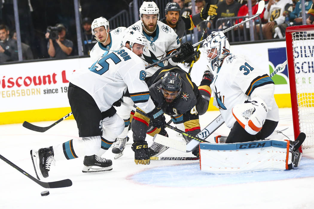 San Jose Sharks goaltender Martin Jones (31) and defenseman Erik Karlsson (65) block a shot fro ...