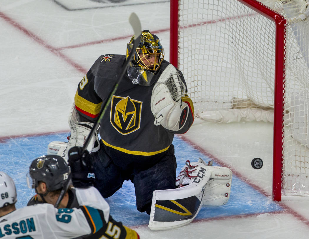 Golden Knights goaltender Marc-Andre Fleury (29) looks as a puck bounces off the post during th ...