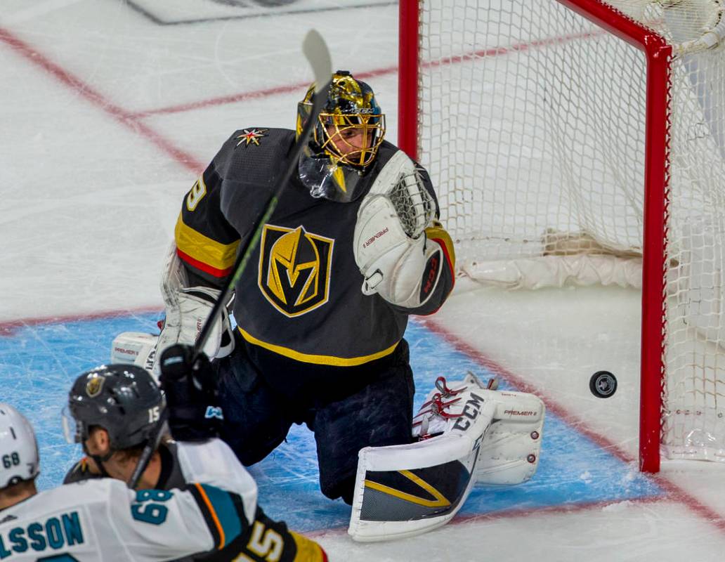 Golden Knights goaltender Marc-Andre Fleury (29) looks as a puck bounces off the post during th ...