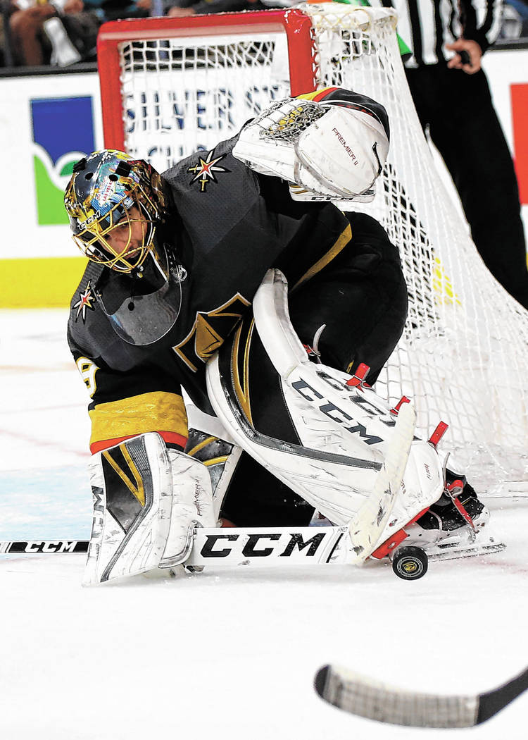 Golden Knights goaltender Marc-Andre Fleury (29) blocks a shot from the San Jose Sharks during ...