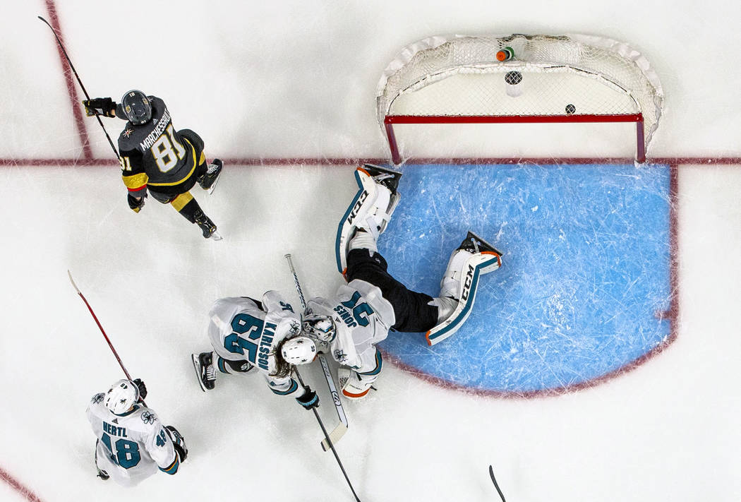 Golden Knights center Jonathan Marchessault (81) scores on San Jose Sharks goaltender Martin Jo ...