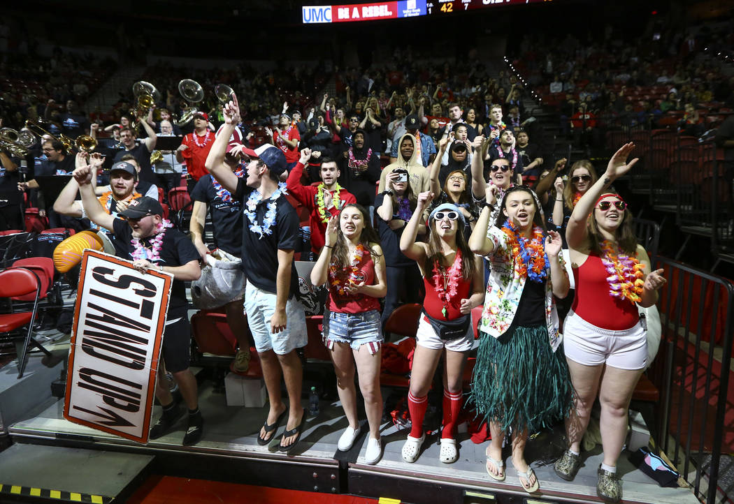 UNLV Rebels fans in the student section cheer during the second half of a basketball game again ...