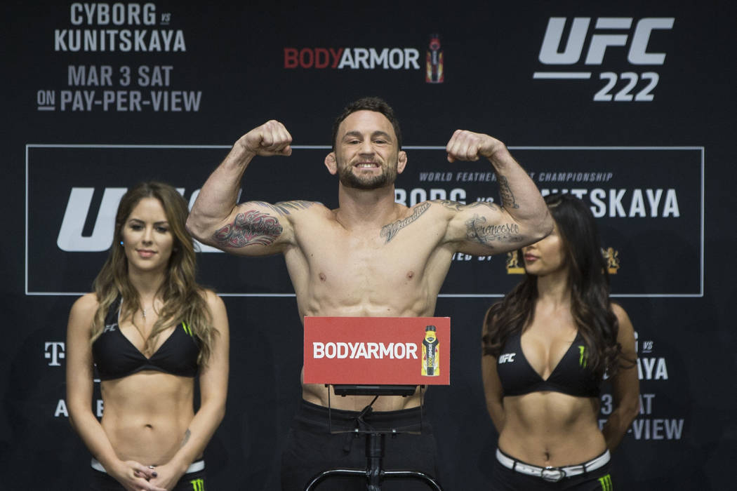 Featherweight Frankie Edgar flexes for the crowd during weighs-ins for UFC 222 at the Park Thea ...