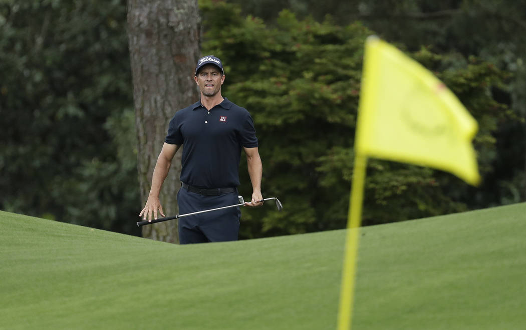 Adam Scott, of Australia, looks over a shot on the eighth hole during the final round for the M ...