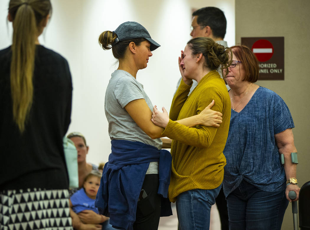 Family members and supporters comfort each other after former Metro officer Pamela Bordeaux, ch ...