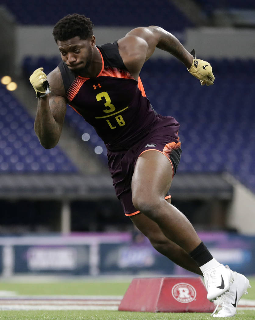 Kentucky linebacker Josh Allen runs a drill at the NFL football scouting combine in Indianapoli ...