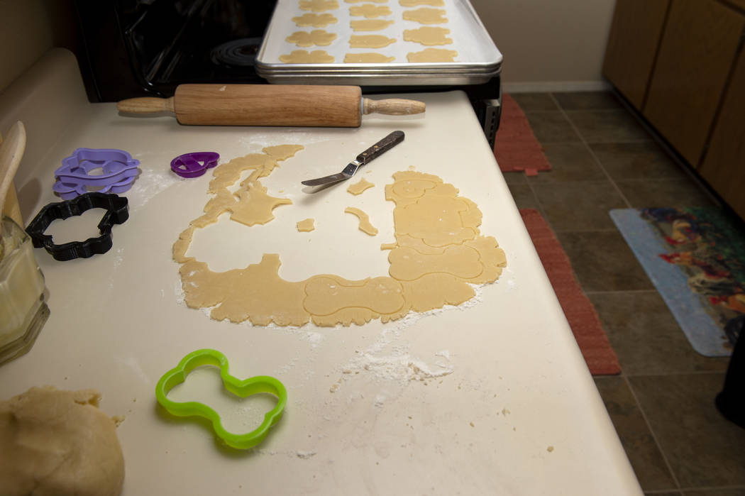 Leftover cookie dough sits out as Owner of Cakes, Cookies and Creations Jessica Dejarnett bakes ...