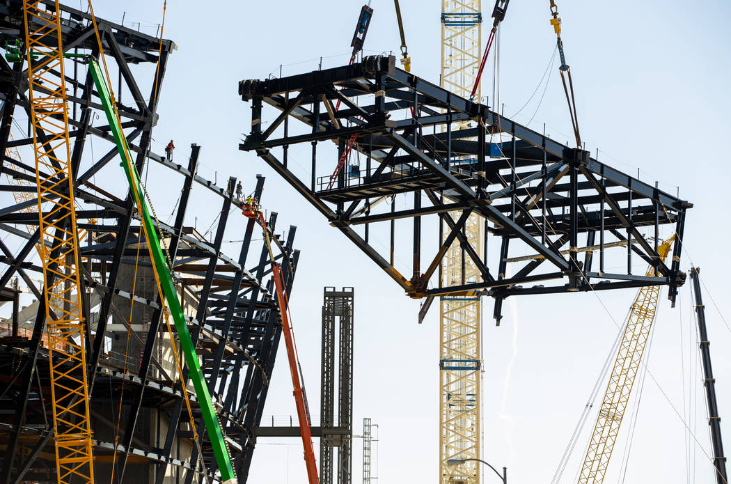 The newest truss is lifted and soon attached to the top of Raiders Stadium on Wednesday, May 1, ...