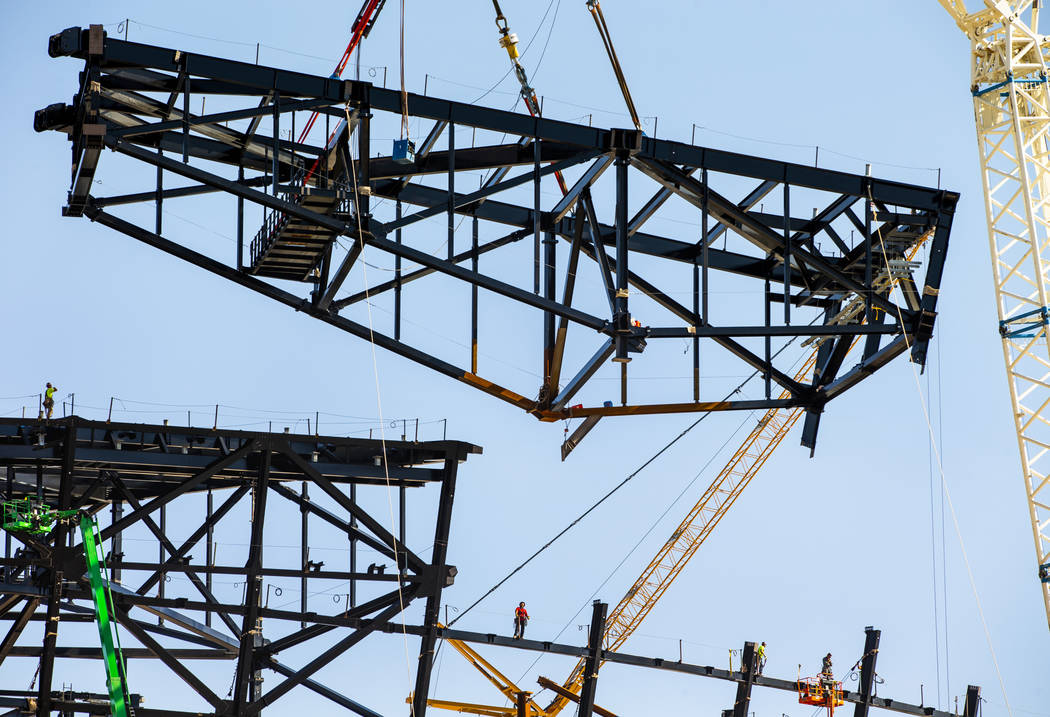 The newest truss is lifted and soon attached to the top of Raiders Stadium on Wednesday, May 1, ...