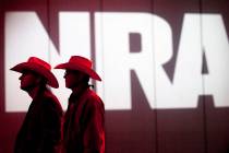 FILE - In this May 4, 2013, file photo, National Rifle Association members listen to speakers d ...