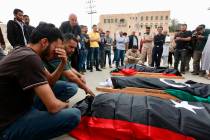 Mourners gather for funeral prayers for fighters killed by warplanes of Field Marshal Khalifa H ...