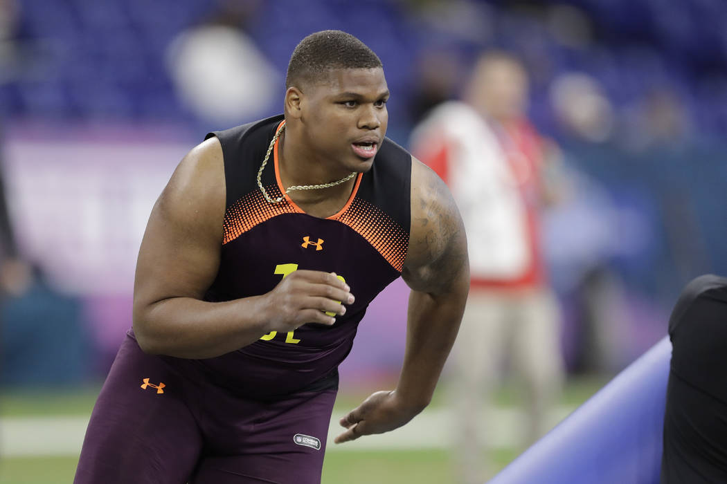 Alabama defensive lineman Quinnen Williams runs a drill during the NFL football scouting combin ...