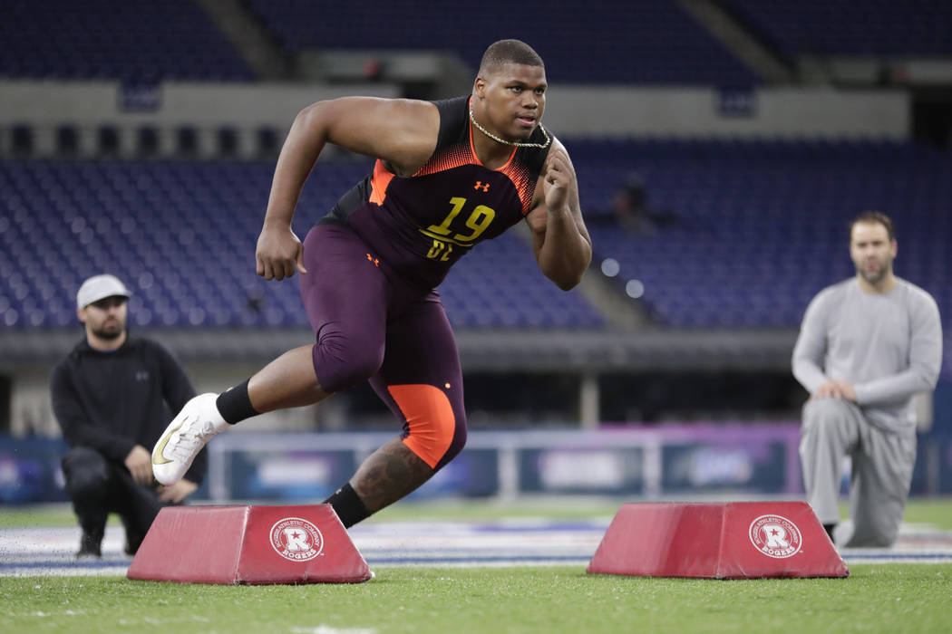 Alabama defensive lineman Quinnen Williams runs a drill at the NFL football scouting combine in ...