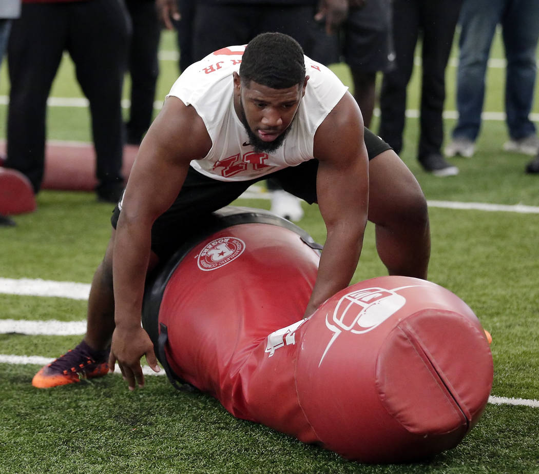 Houston defensive lineman Ed Oliver Jr. participates in drills during Pro Day at the indoor foo ...