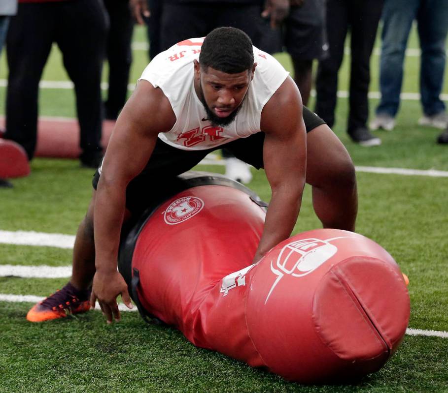 Houston defensive lineman Ed Oliver Jr. participates in drills during Pro Day at the indoor foo ...