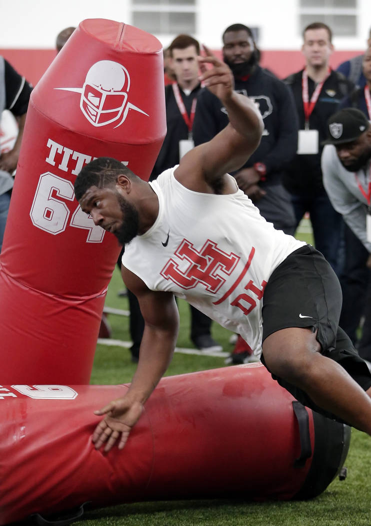 Houston defensive lineman Ed Oliver Jr. participates in drills during Pro Day at the indoor foo ...