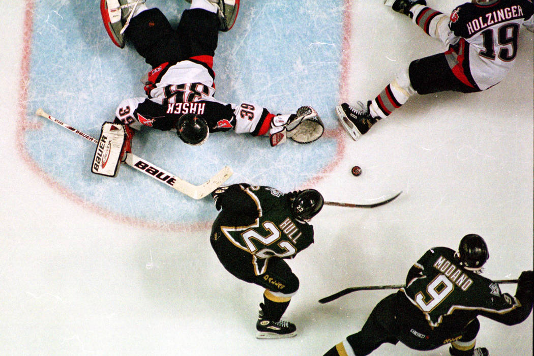 With one skate in the crease, Dallas Stars right wing Brett Hull (22) shoots the Stanley Cup wi ...