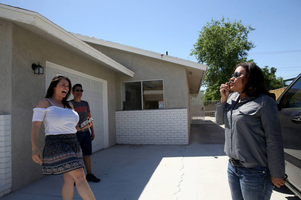 Ana Martinez, a veteran who was homeless two years ago, kisses the key to her new Las Vegas hom ...
