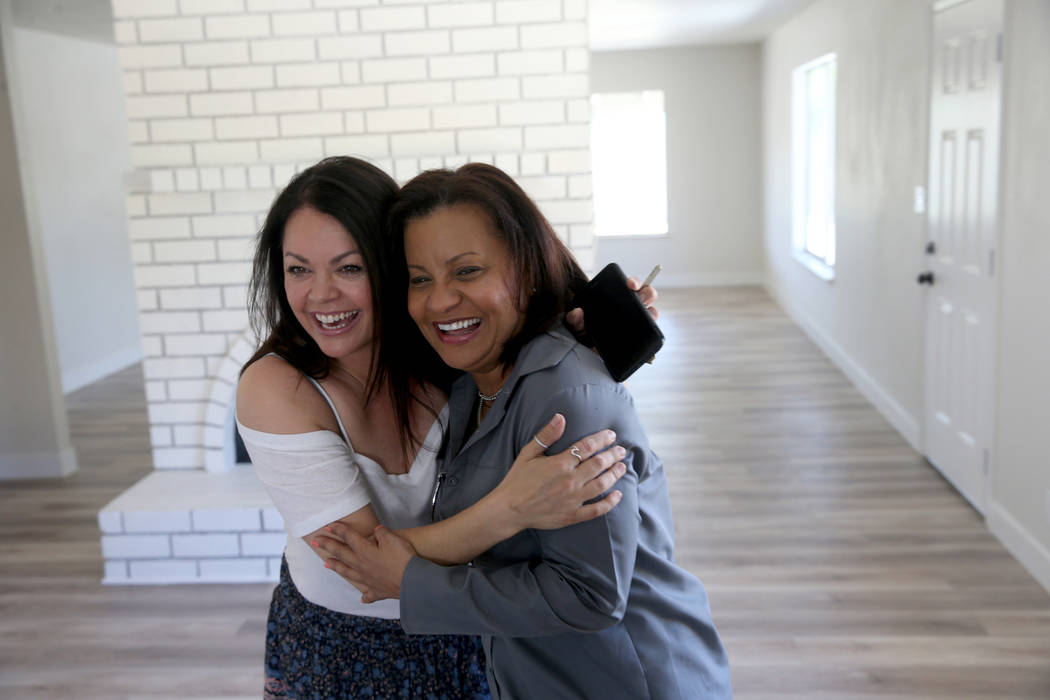 Ana Martinez, right, a veteran who was homeless two years ago, hugs her agent Sonja Catlin afte ...
