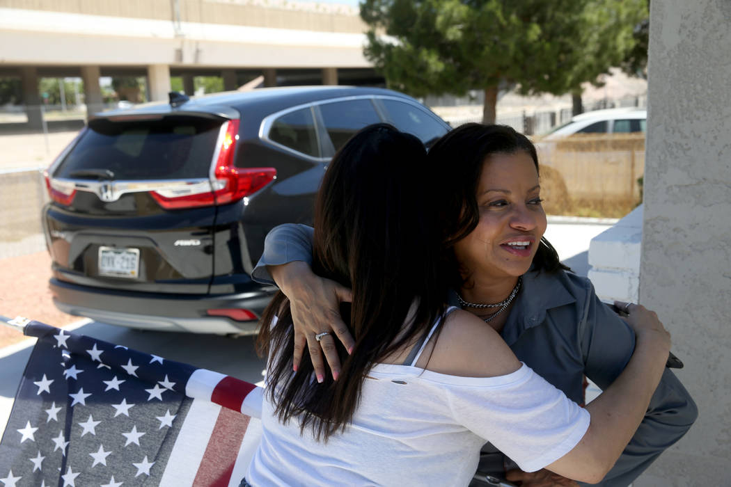 Ana Martinez, a veteran who was homeless two years ago, hugs her agent Sonja Catlin as she pre ...