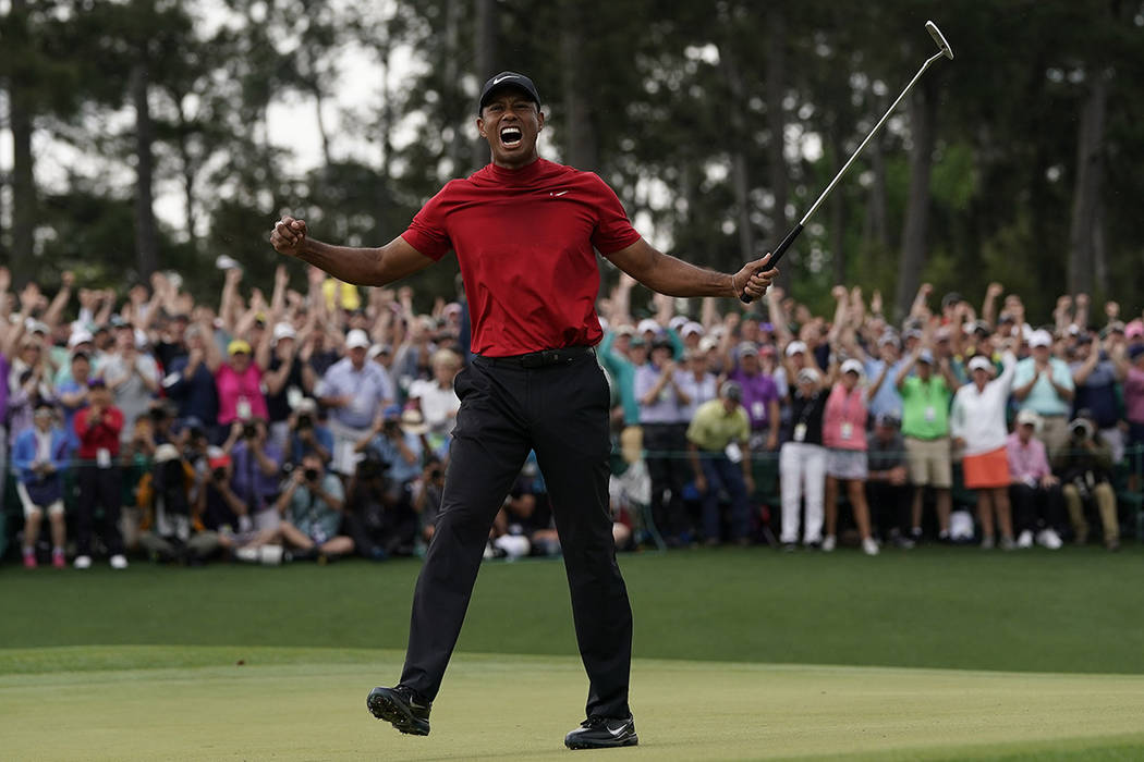 Tiger Woods reacts as he wins the Masters golf tournament Sunday, April 14, 2019, in Augusta, G ...