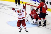 Carolina Hurricanes left wing Brock McGinn, left, celebrates his game-winning goal during doubl ...