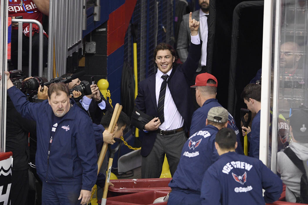 Washington Capitals' T.J. Oshie points as he pumps up the crowd during a break in the action in ...