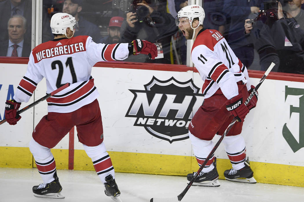 Carolina Hurricanes center Jordan Staal (11) celebrates his goal with right wing Nino Niederrei ...