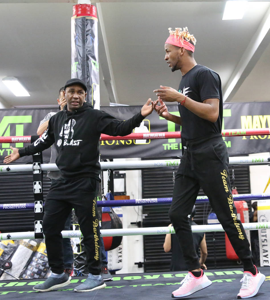 Former two-division world champion Rances Barthelemy works out as his trainer Joel Casamayor, l ...