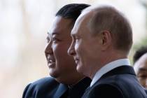 Russian President Vladimir Putin, right, and North Korea's leader Kim Jong Un pose for a photo ...