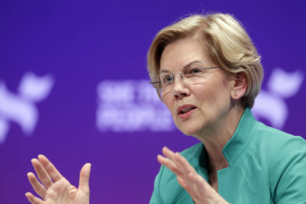 Democratic presidential candidate Sen. Elizabeth Warren, D-Mass., answers questions during a pr ...