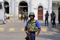 Sri Lankan navy soldiers secure the area out side St. Anthony's Church in Colombo, Sri Lanka, T ...