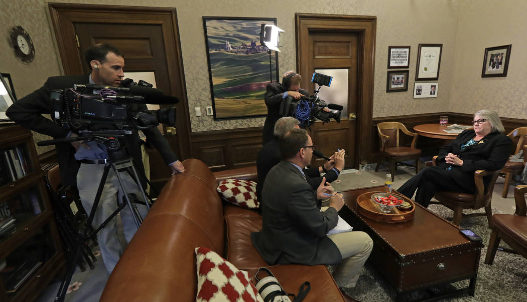 Sen. Maureen Walsh, R-College Place, right, talks to reporters, Monday, April 22, 2019, at the ...