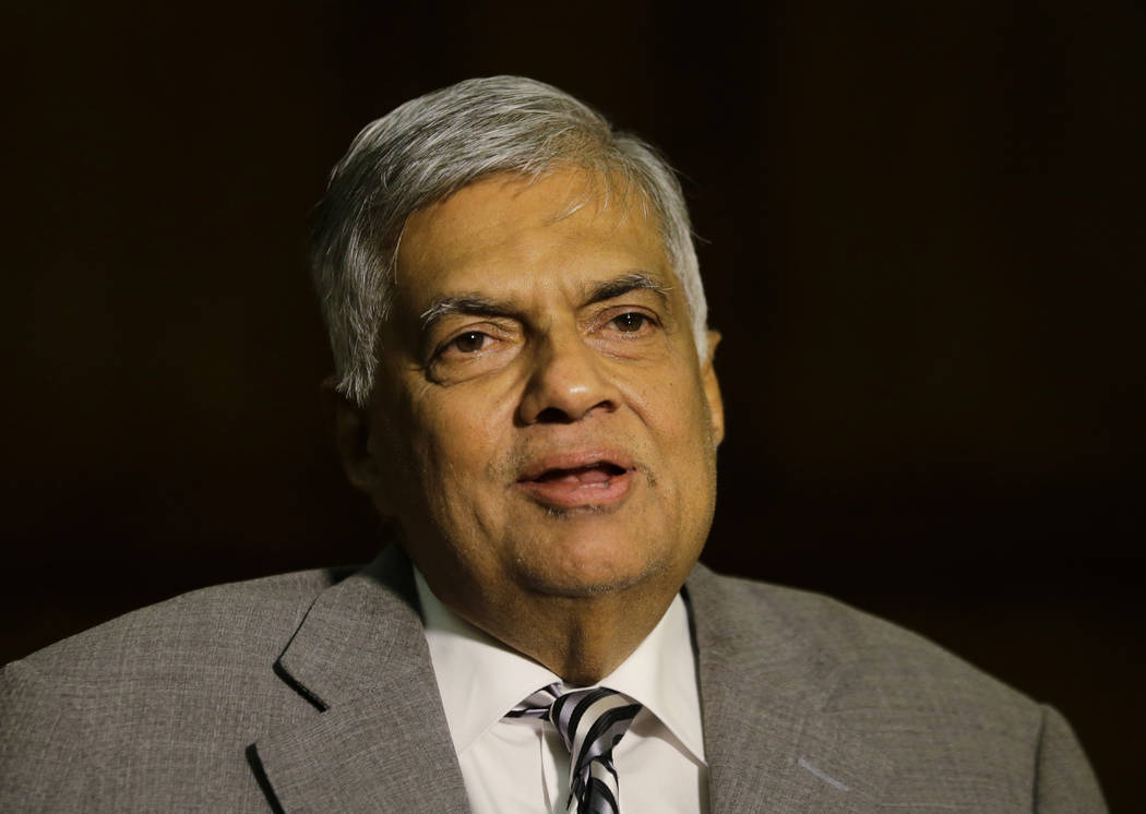 Sri Lankan Prime Minister Ranil Wickremesinghe takes a question during an interview with the As ...