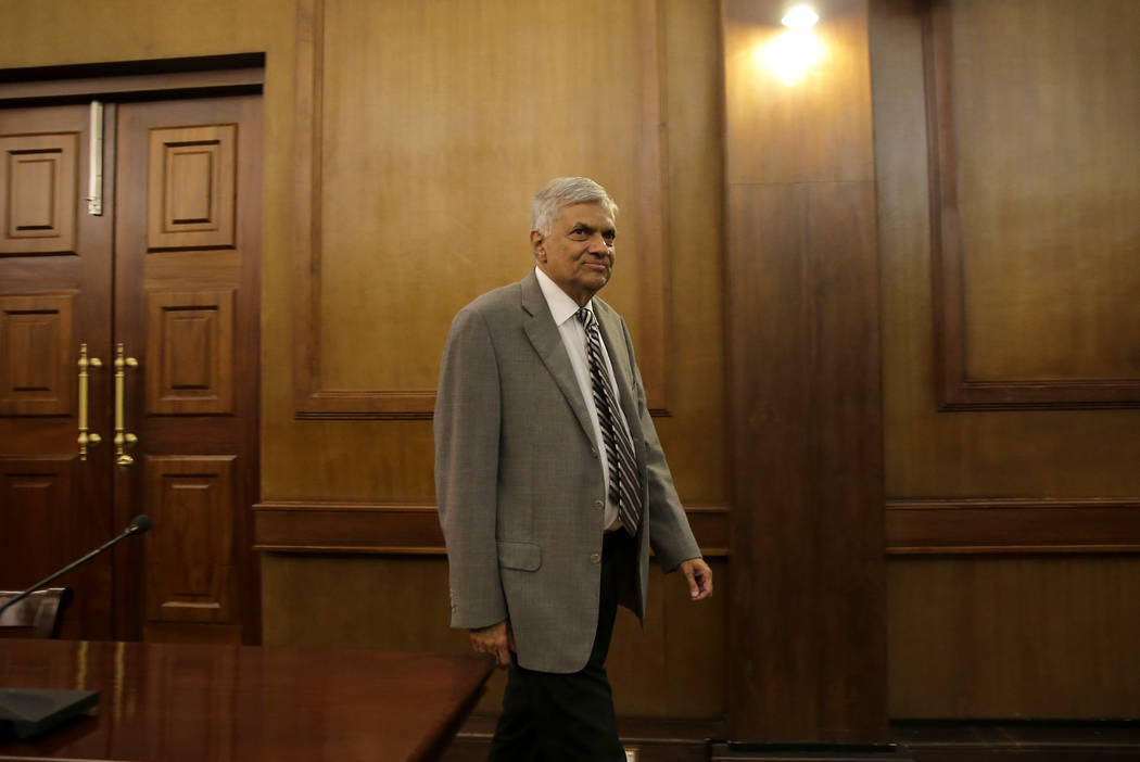 Sri Lankan Prime Minister Ranil Wickremesinghe arrives for an interview with the Associated Pre ...