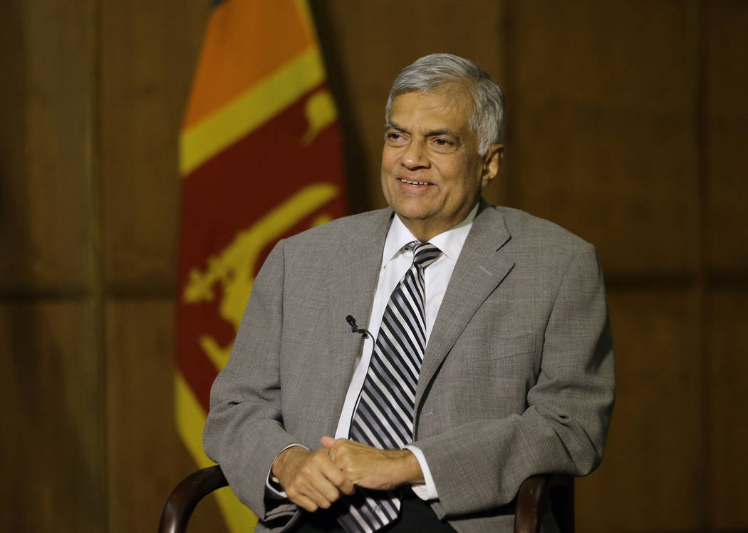 Sri Lankan Prime Minister Ranil Wickremesinghe takes a question during an interview with the As ...