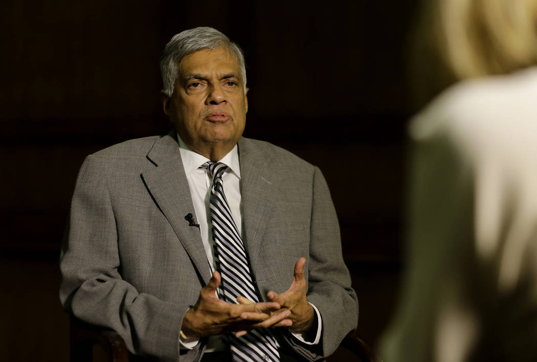 Sri Lankan Prime Minister Ranil Wickremesinghe takes a question during an interview with the As ...