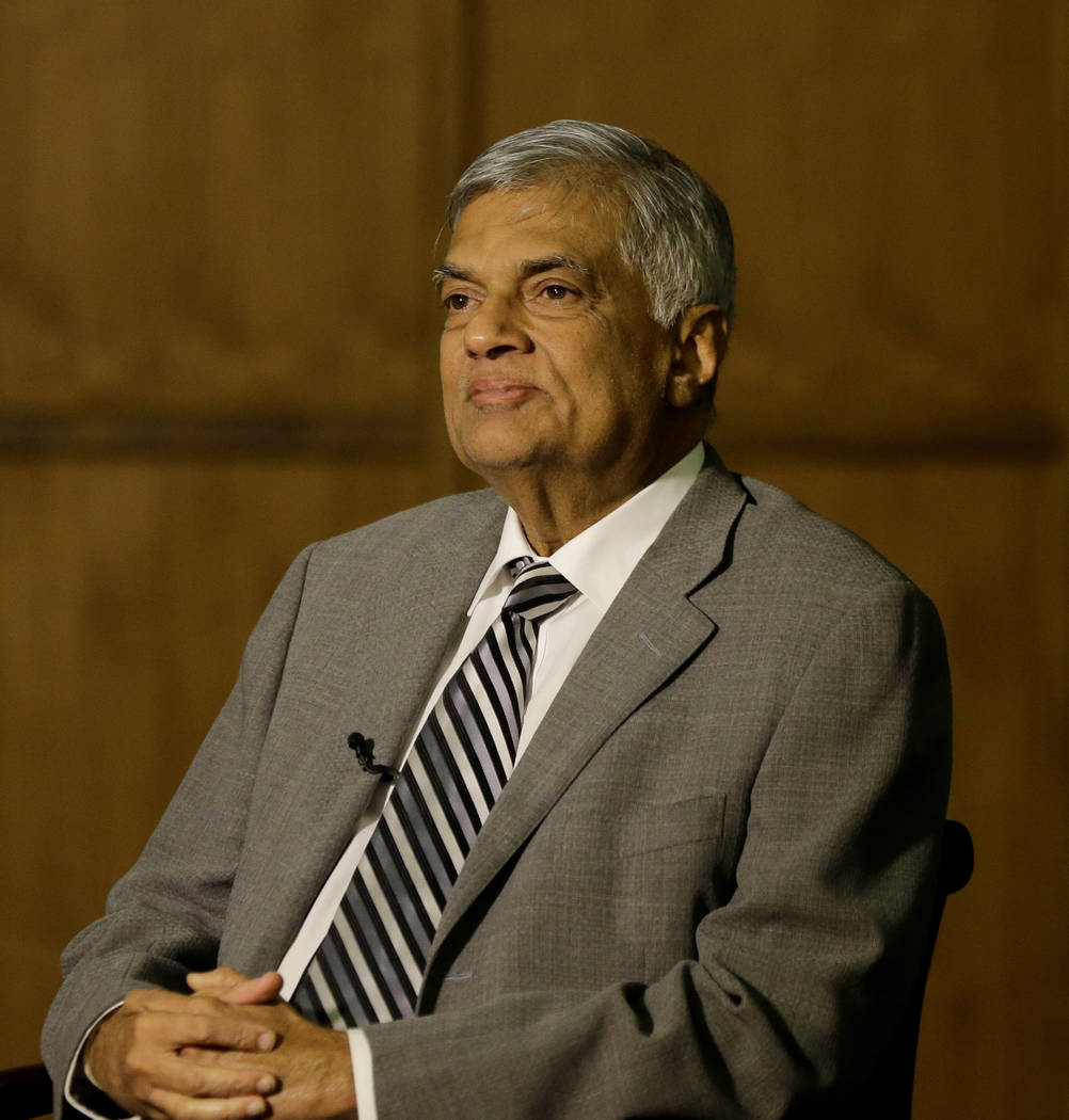 Sri Lankan Prime Minister Ranil Wickremesinghe takes a question during an interview with the As ...